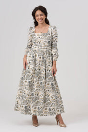 Woman wearing a floral dress on a white background