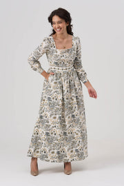 Woman wearing a floral dress on a white background