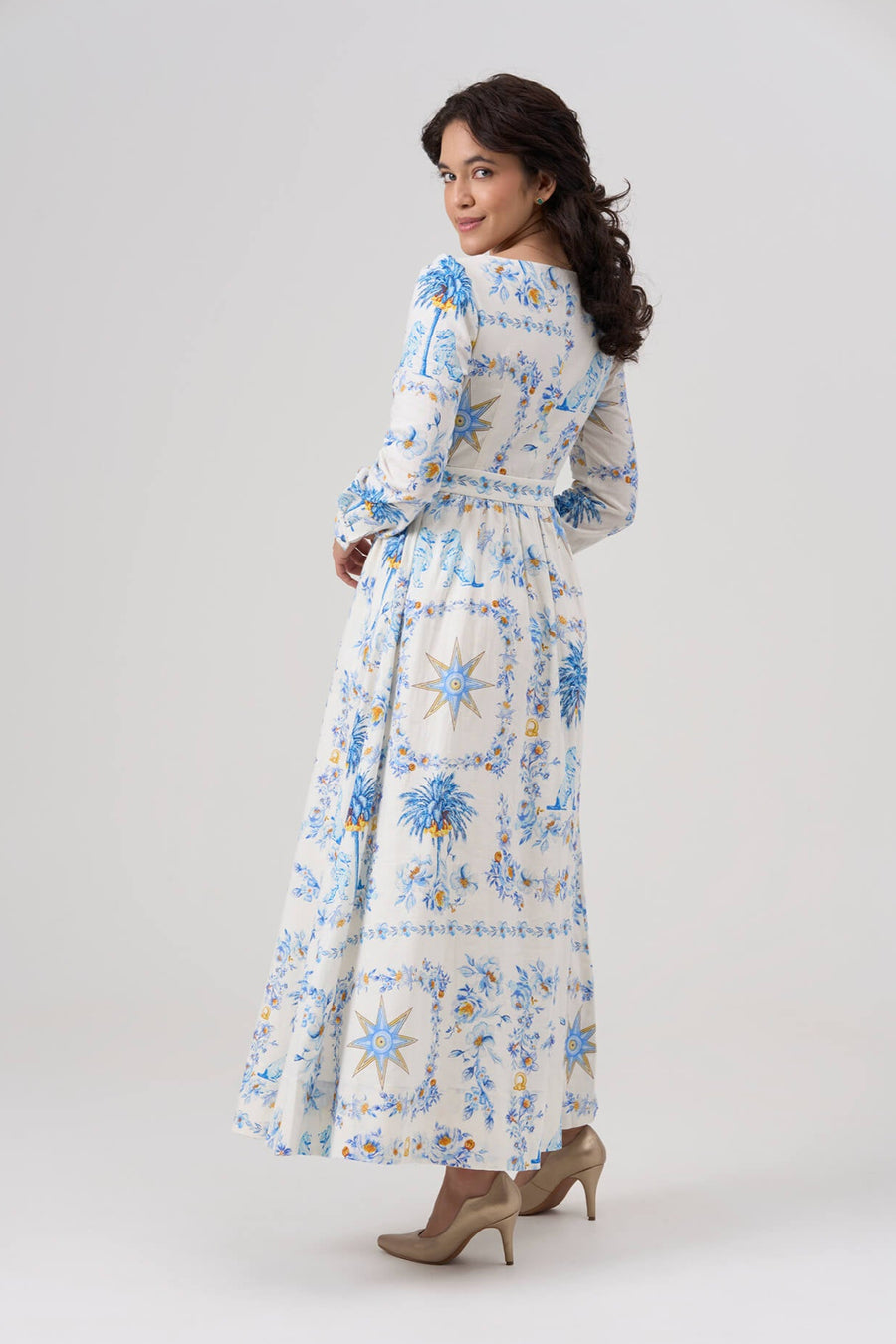 Woman wearing a floral dress on a white background