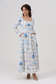 Woman wearing a floral dress on a white background